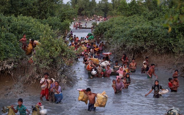 Rohingya refugees cross the Naf River.JPG