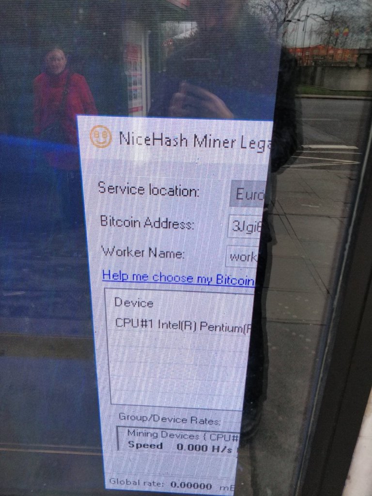 Close up of the window. It is a BitCoin miner