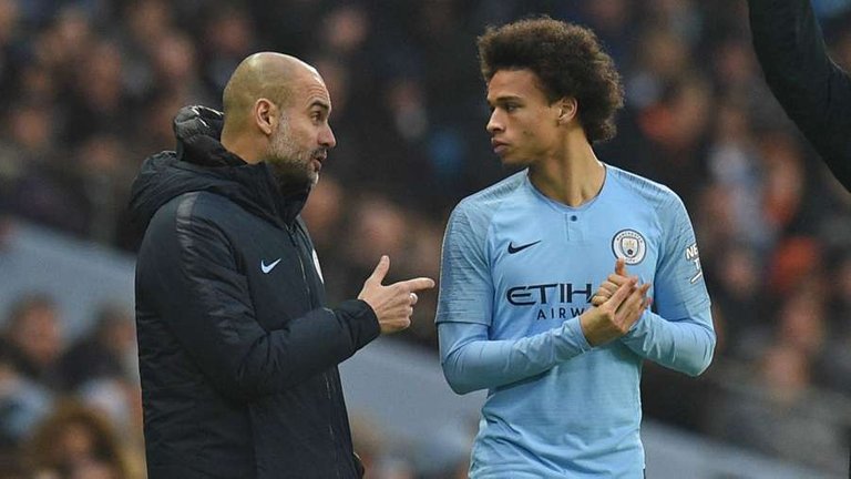 1556070424_pep-guardiola-leroy-sane-manchester-city-2018-19_1hff4eq8yvs6s1m057i34scyc2.jpg