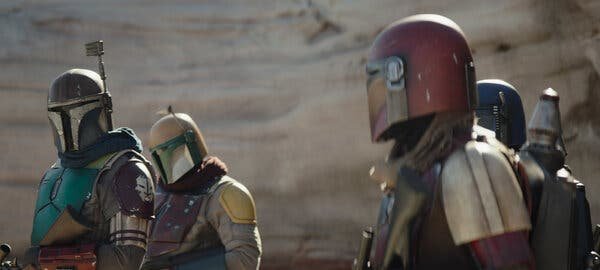 A group of helmeted Mandalorians.