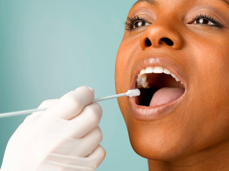 person-putting-dna-test-swab-into-woman-s-mouth-close-up-studio-shot-sb10068771g-004-57f3bf4b3df78c690f35e3d0.jpg