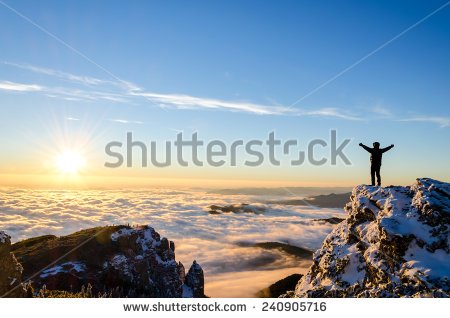 stock-photo-hiker-celebrating-success-on-top-of-a-mountain-in-a-majestic-sunrise-240905716.jpg