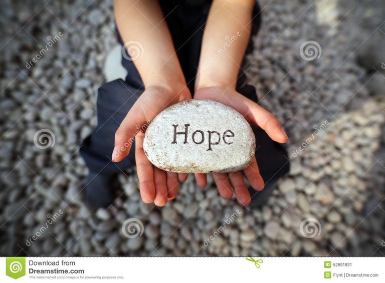 hope-child-beach-hands-cupped-holding-stone-pebble-word-engraved-concept-faith-love-spirituality-52691931.jpg