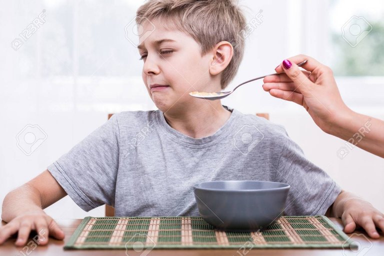 47629993-picky-eater-boy-refusing-to-eat-disgusting-food-Stock-Photo.jpg