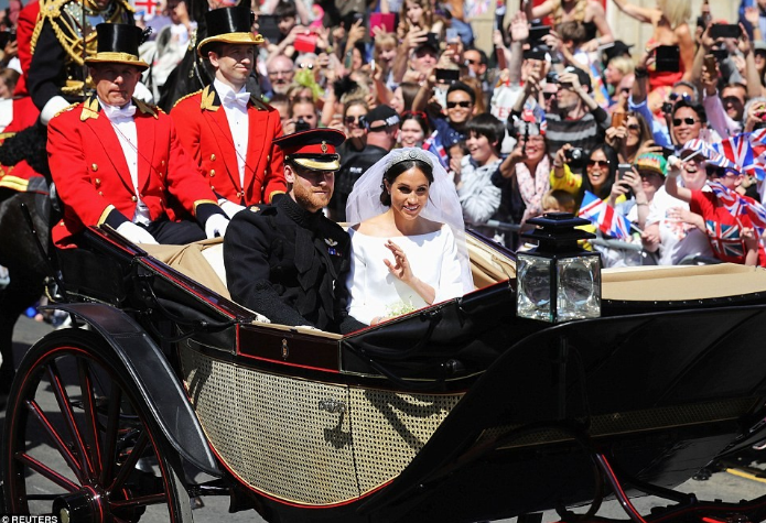 Stunning photos as Prince Harry and Meghan Markle's process through the streets of Windsor_003.png