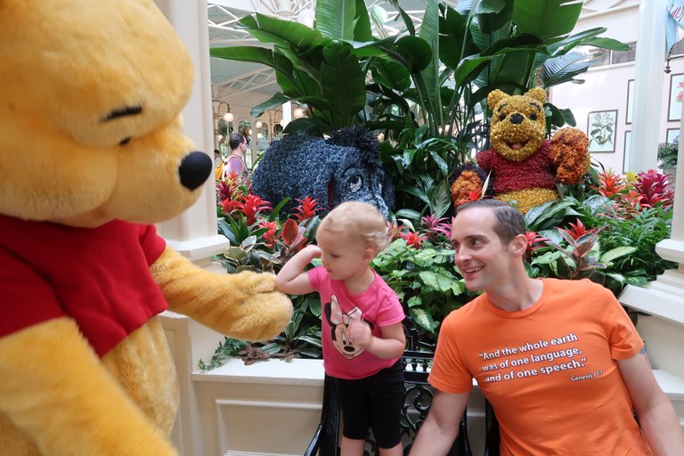 Winnie the pooh high five at character breakfast Crystal Palace Magic Kingdom theme park at Walt Disney World Resort September 2017.JPG