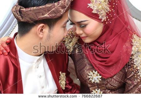 stock-photo-muslim-wedding-couple-wearing-malay-traditional-clothing-on-wedding-ceremony-766822687.jpg