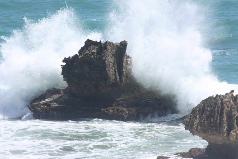 Barbados - Bathsheba - Ocean breaking over eroded boulders.JPG