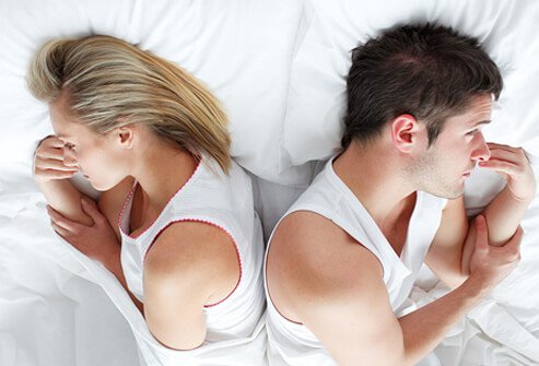female-sexual-problems-s3-photo-of-troubled-couple-lying-in-bed.jpg