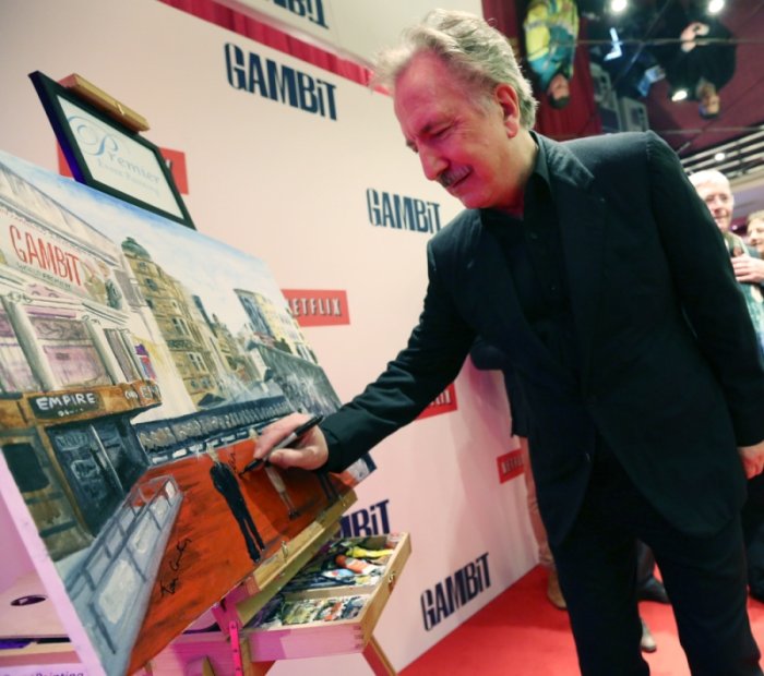 Alan-Rickman-signing-painting.jpg