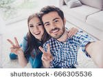 stock-photo-cheerful-playful-sister-and-brother-are-taking-selfie-and-showing-peace-signs-they-are-at-home-666305536.jpg