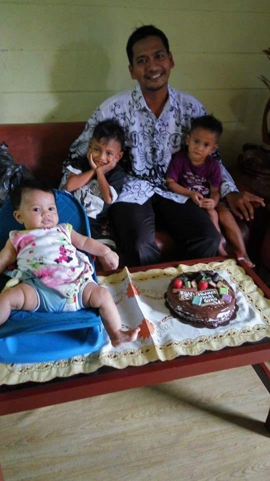 surya and children with cake.jpg