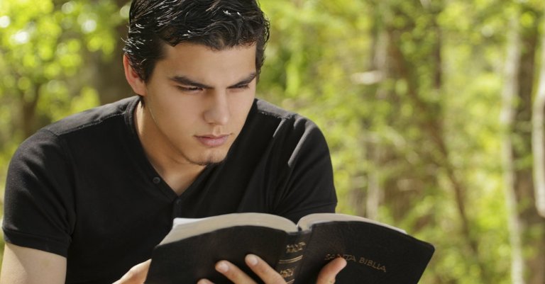 30988-youngmanreadinbible.1200w.tn.jpg