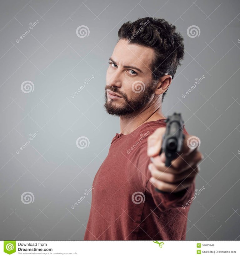 cool-young-man-holding-gun-confident-aggressive-attitude-59073242.jpg