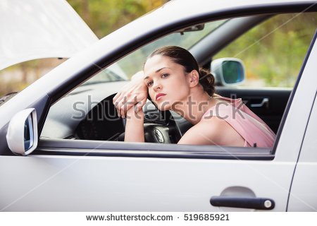 stock-photo-young-woman-sad-in-her-car-because-it-broke-519685921.jpg
