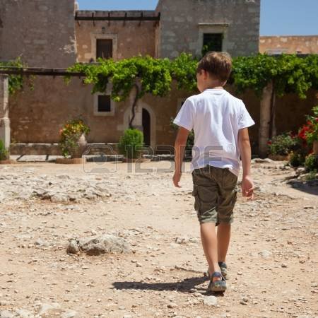 15474804-small-boy-walking-near-old-greece-monastery-of-agia-triada-crete.jpg