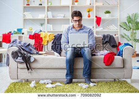 stock-photo-young-man-working-studying-in-messy-room-709082092.jpg