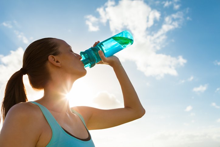 Woman-drinking-out-of-water-bottle.jpg