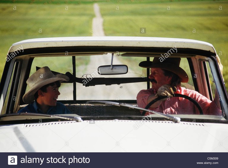 cowboy-and-son-pickup-truck-and-gun-rack-montana-C5M309.jpg