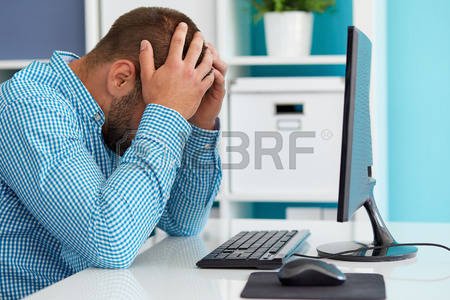 44500466-young-business-man-under-stress-with-headache.jpg