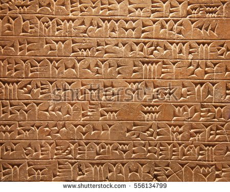 stock-photo-ancient-sumerian-stone-carving-with-cuneiform-scripting-556134799.jpg