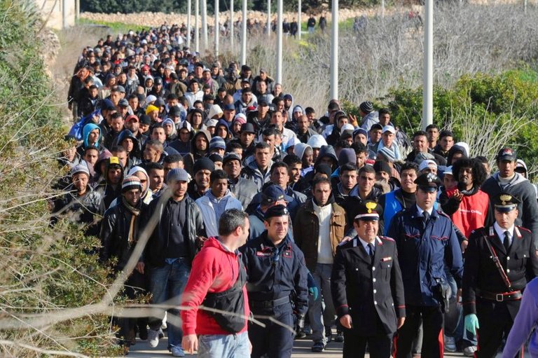 tunisian-migrants-arrive-in-italy.jpg