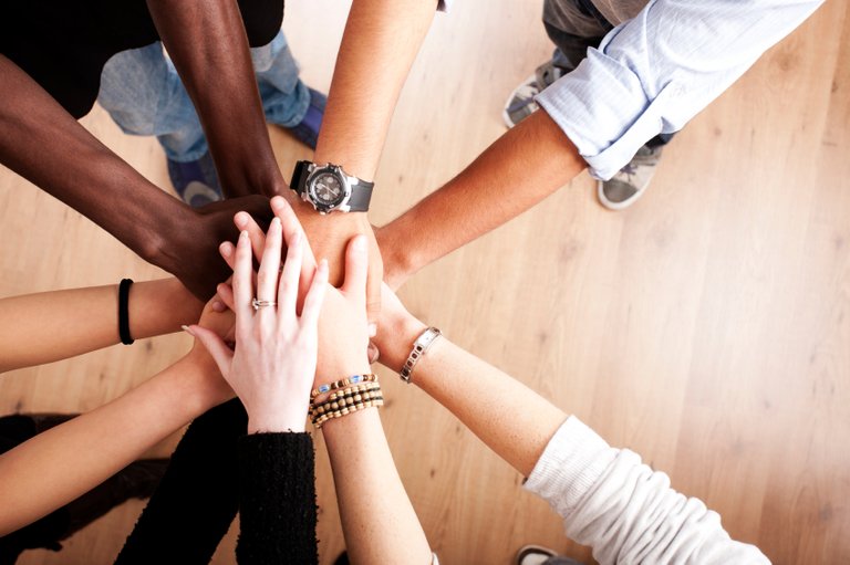 Teamwork_Coworkers_Hands_Huddle_iStock_000014186302Small.jpeg