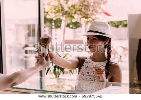 stock-photo-woman-buying-ice-cream-on-the-market-stall-692975542.jpg