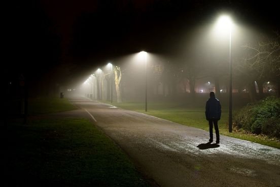 somber-teen-walks-alone-on-a-dark-path-the-overhead-floodlighting-of-streetlamps-and-the-suburban-setting-hint-at-a-deeper-significance-it-is-a-metaphor-maybe-4115-ee60d5d638f94beebee6484a03222213@1x.jpg