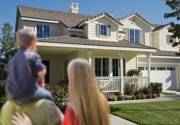 family-of-three-looking-at-house.jpg