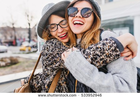 stock-photo-happy-brightful-positive-moments-of-two-stylish-girls-hugging-on-street-in-city-closeup-portrait-533952946.jpg