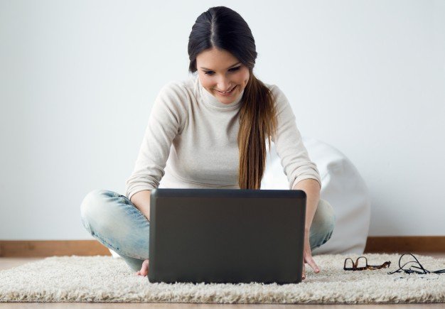 beautiful-young-woman-working-on-her-laptop-at-home_1301-4315.jpg