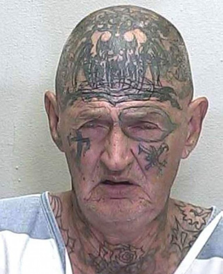 Old-Man-With-Tribal-Face-And-Head-Tattoos.jpg