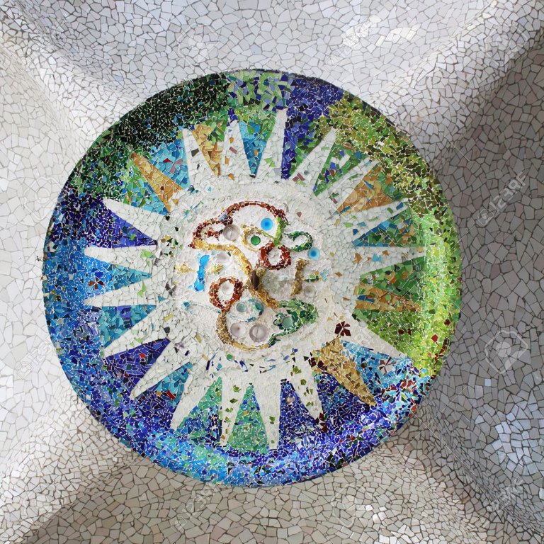 13033838-Detail-of-Antonio-Gaudi-s-mosaic-style-at-Parc-Guell-in-Barcelona-Stock-Photo.jpg