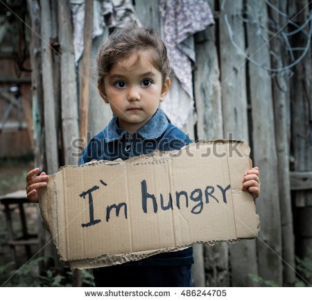 stock-photo-little-girl-holding-a-sheet-of-cardboard-on-the-cardboard-label-i-am-hungry-the-child-is-three-486244705.jpg