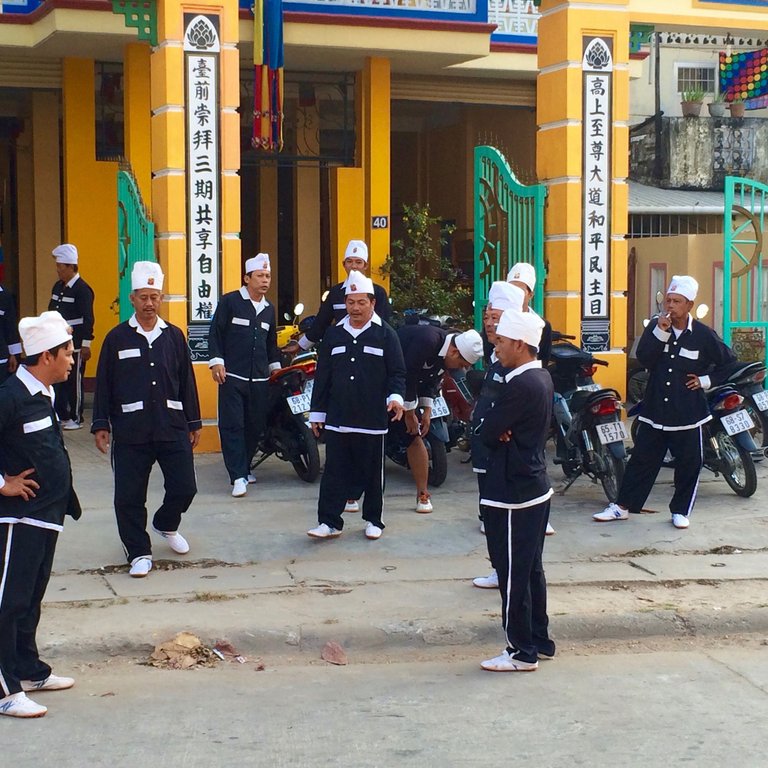 3 Male followers preparing for a ceremony in the very early morning..jpg