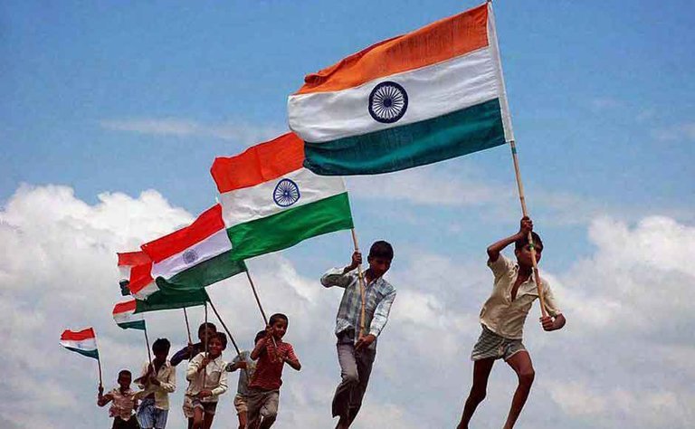 Small-Children-Running-With-Indian-Flags-Happy-Independence-Day-On-15-August.jpg