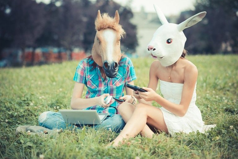 graphicstock-mask-horse-and-rabbit-women-sisters-friends-using-smartphone-and-tablet-in-the-park_rpbl82ko1Z_tn.jpg