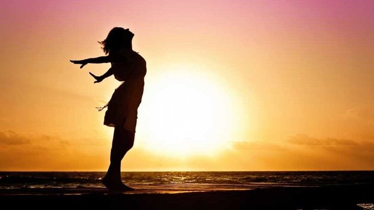 woman-happiness-sunrise-silhouette-dress-beach-e1465472196124.jpg