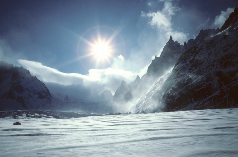 snow-mountain-sun-clouds.jpg