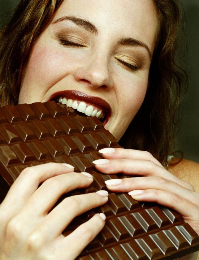 woman-biting-huge-chocolate-bar.jpg