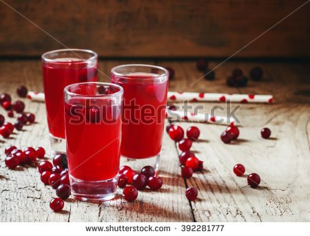 stockphotoredcocktailwithnaturalcranberryjuiceandvodkaoldwoodenbackgroundselectivefocus392281777.jpg