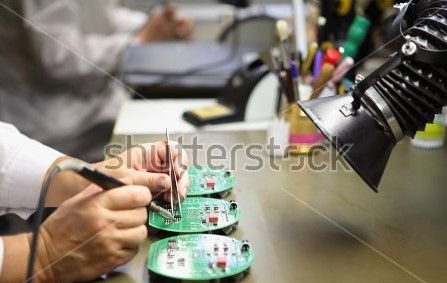 stock-photo-electronics-manufacturing-services-manual-assembly-of-circuit-board-soldering-close-up-of-the-558424717.jpg