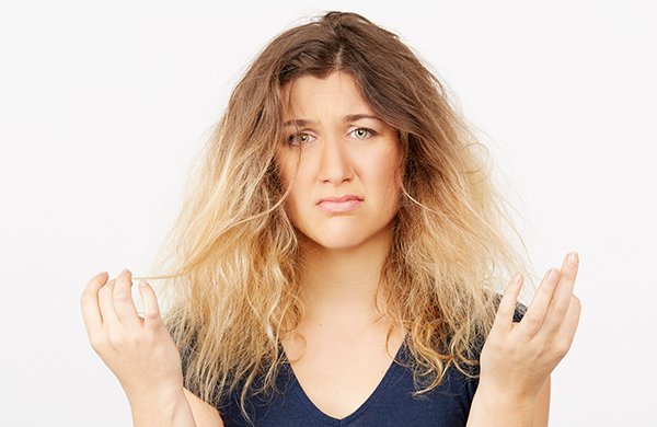 woman-unhappy-with-dry-damaged-frizzy-hair-1__1__jpg-600x390.jpg