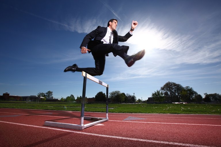 bigstock-Businessman-jumping-over-hurdl-14086169.jpg