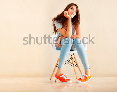 stock-photo-full-length-of-cute-woman-sitting-on-chair-and-daydreaming-72972223.png