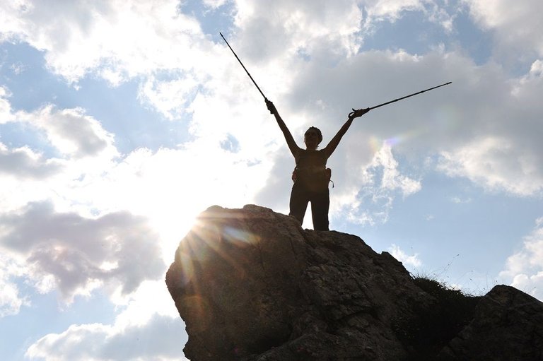 silhouette-of-a-woman-during-and-adventage-climbing-and-mountain-walking_rtrWf196Hs.jpg