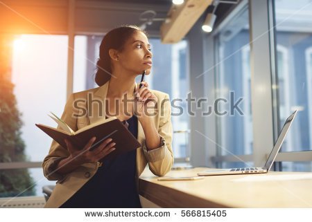 stock-photo-portrait-of-skillful-afro-american-female-executive-thinking-over-working-schedule-for-employee-566815405.jpg