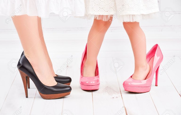 41509619-legs-mother-and-daughter-little-girl-fashionista-in-pink-shoes-on-high-heels.jpg