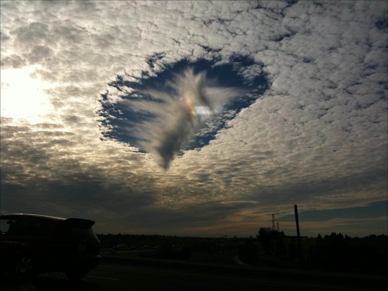 Skypunch - A rare meteorological phenomenon where ice crystals.jpg